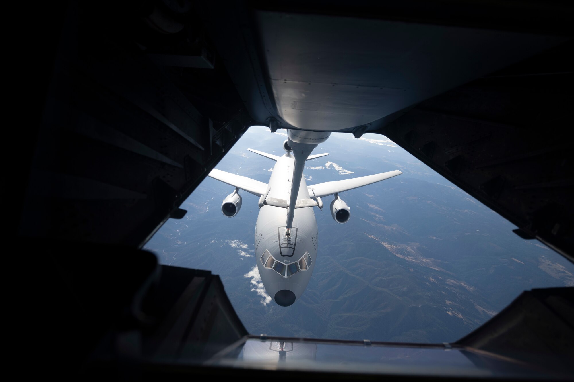 A KC-10 Extender simulates air refueling procedures with another KC-10 Nov. 16, 2020, over Oregon. Aircrew for both aircraft, assigned to the 6th Air Refueling Squadron at Travis Air Force Base, California, simulated the procedures as part of a basewide exercise. (U.S. Air Force photo by Airman 1st Class Alexander Merchak)