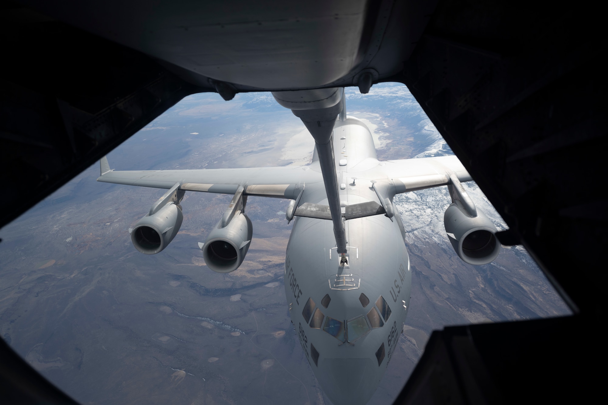 A KC-10 Extender boom makes contact with a C-17 Globemaster III Nov. 16, 2020, over Oregon. The aircrew for both aircraft, assigned to Travis Air Force Base, California, simulated air refueling procedures as part of a basewide exercise. (U.S. Air Force photo by Airman 1st Class Alexander Merchak)