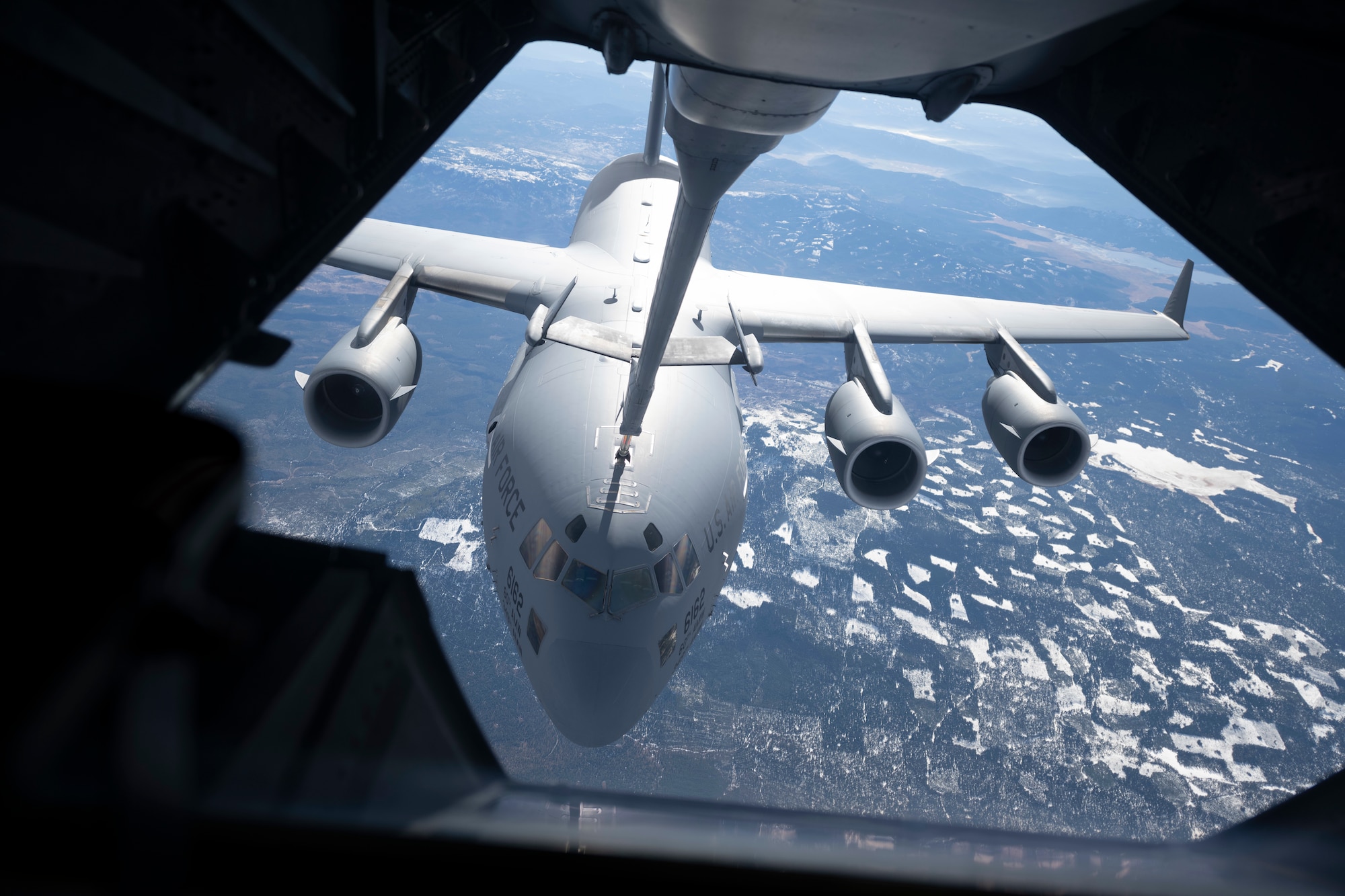 A KC-10 Extender simulates air refueling procedures with a C-17 Globemaster III Nov. 16, 2020, over Oregon. The aircrew for both aircraft from Travis Air Force Base, California, simulated air refueling procedures as part of a basewide exercise. (U.S. Air Force photo by Airman 1st Class Alexander Merchak)