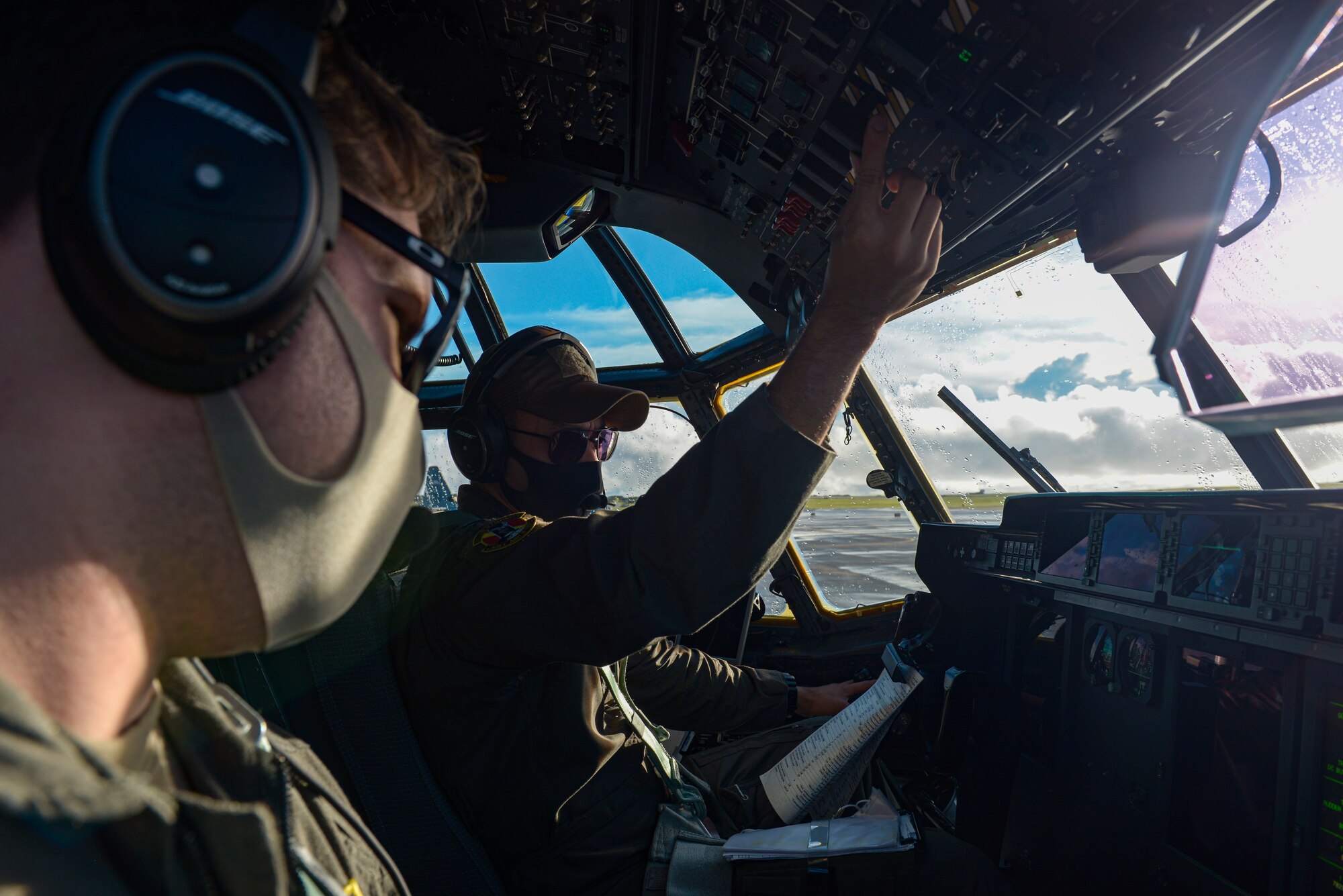 U.S. Air Force Capt. Andrew Zaldiver(left), and USAF Capt. Emery Gumapas, both C-130J Hercules pilots assigned to the 36th Airlift Squadron, Yokota Air Base, Japan, perform pre-inspections on a C-130J before takeoff during a Dynamic Force Employment at Andersen Air Force Base, Guam, Nov. 23,2020. DFE is an operational platform that allows our forces to be strategically predictable and operationally unpredictable. (U.S. Air Force photo by Senior Airman Michael S. Murphy)
