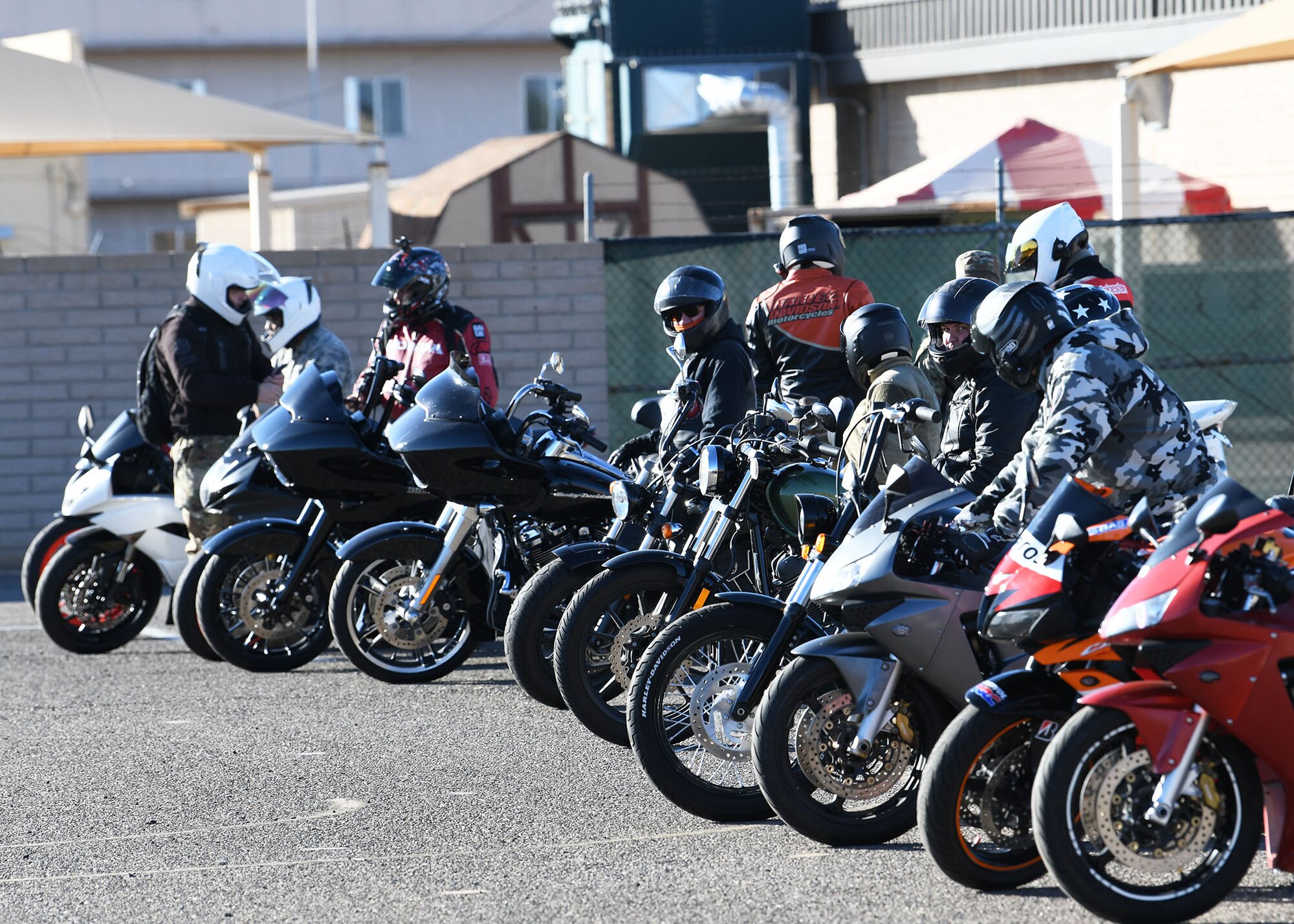 Members of the 944th Fighter Wing start their engines as they prepare to depart on a motorcycle safety program mentorship ride Nov. 8 at Luke Air Force Base, Ariz. The program provides members with their required motorcycle safety training certification.