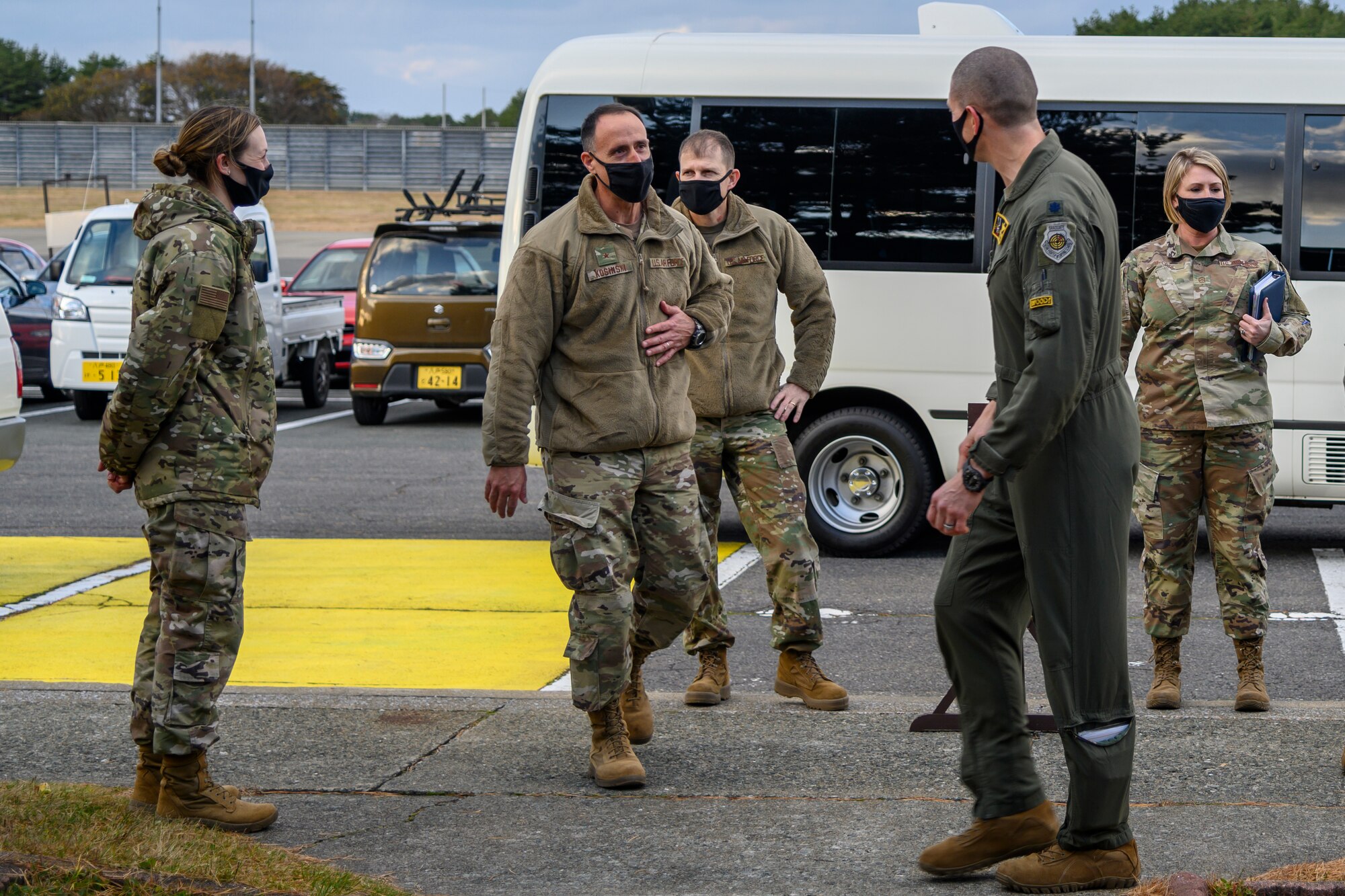 U.S. Air Force Brig. Gen. Leonard J. Kosinski, the 5th Air Force vice commander, and Chief Master Sgt. Kathleen McCool, 5th AF command chief, prepare to walk into the 14th Fighter Squadron at Misawa Air Base, Japan, Nov. 23, 2020. During their two-day visit, Kosinski and McCool received mission briefs from various 35th Fighter Wing units and agencies, had the opportunity to meet and interact with Airmen, and learn about the various roles Team Misawa members play to keep their community safe. (U.S. Air Force photo by Airman 1st Class China M. Shock)
