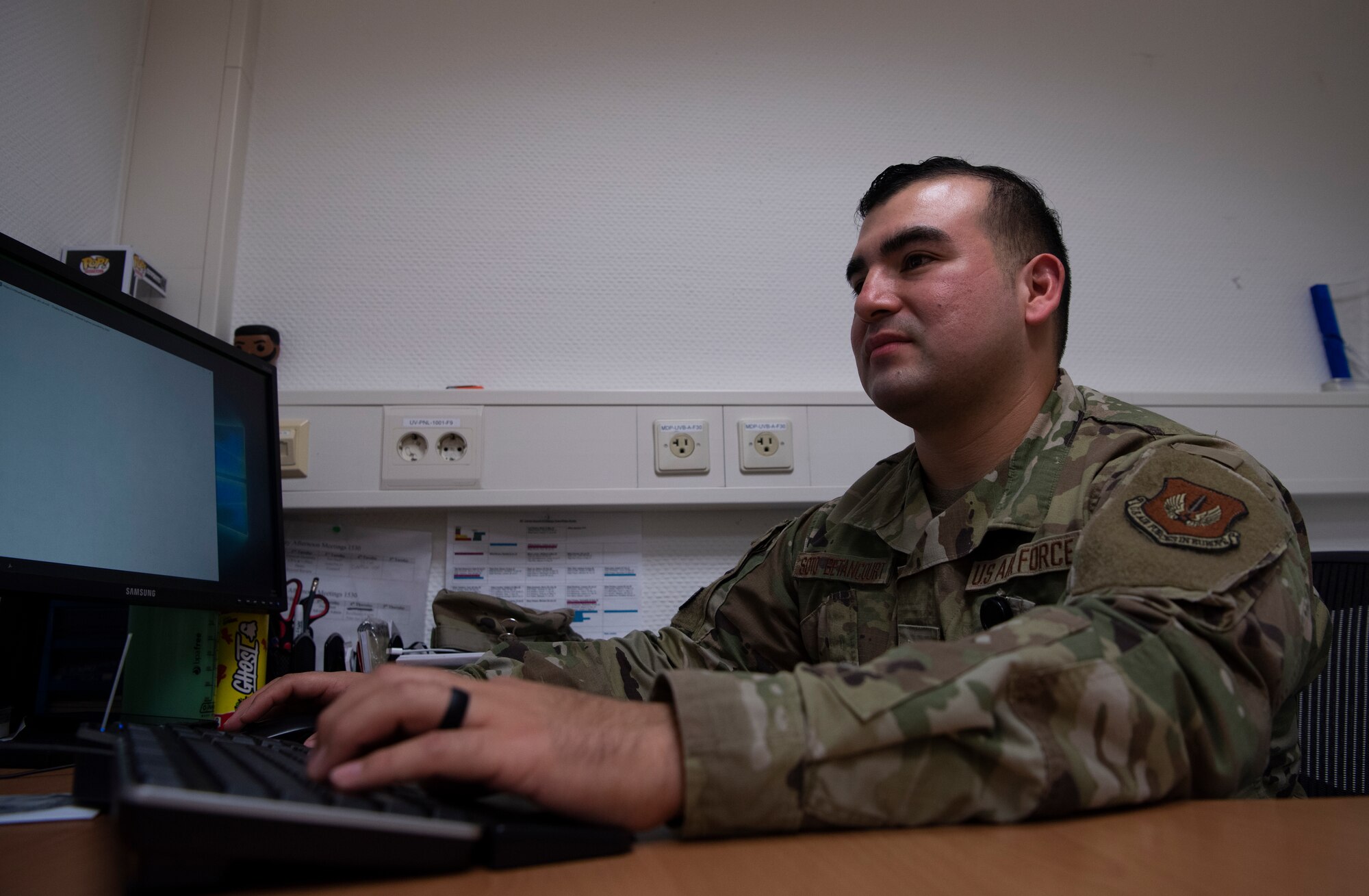 U.S. Air Force Tech. Sgt. Cesar Soto-Betancourt, 86th Dental Squadron general dentistry noncommissioned officer in charge, types an enlisted performance report at Ramstein Air Base, Germany, Nov. 23, 2020.