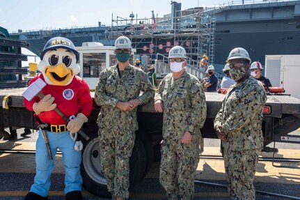 200928-N-XX785-015 - Yardbird Sam, NNSY Commander Rear Adm. Howard Markle, NNSY Deputy Shipyard Commander Capt. Dan Rossler, and NNSY's Command Master Chief CMDCM Gene Garland at the arrival of the USS Pasadena (SSN 752).