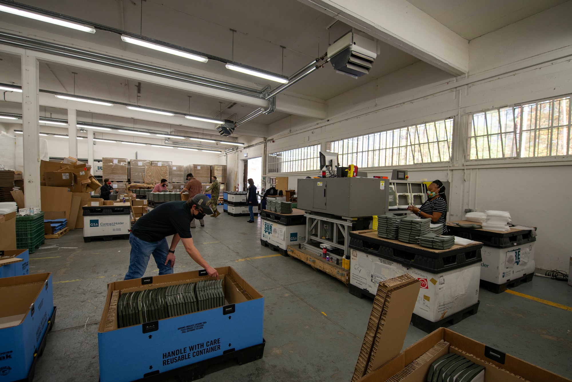 Department of Defense contractors process ballistic vest plates through the examination process at Ramstein Air Base, Germany, Oct. 29, 2020.