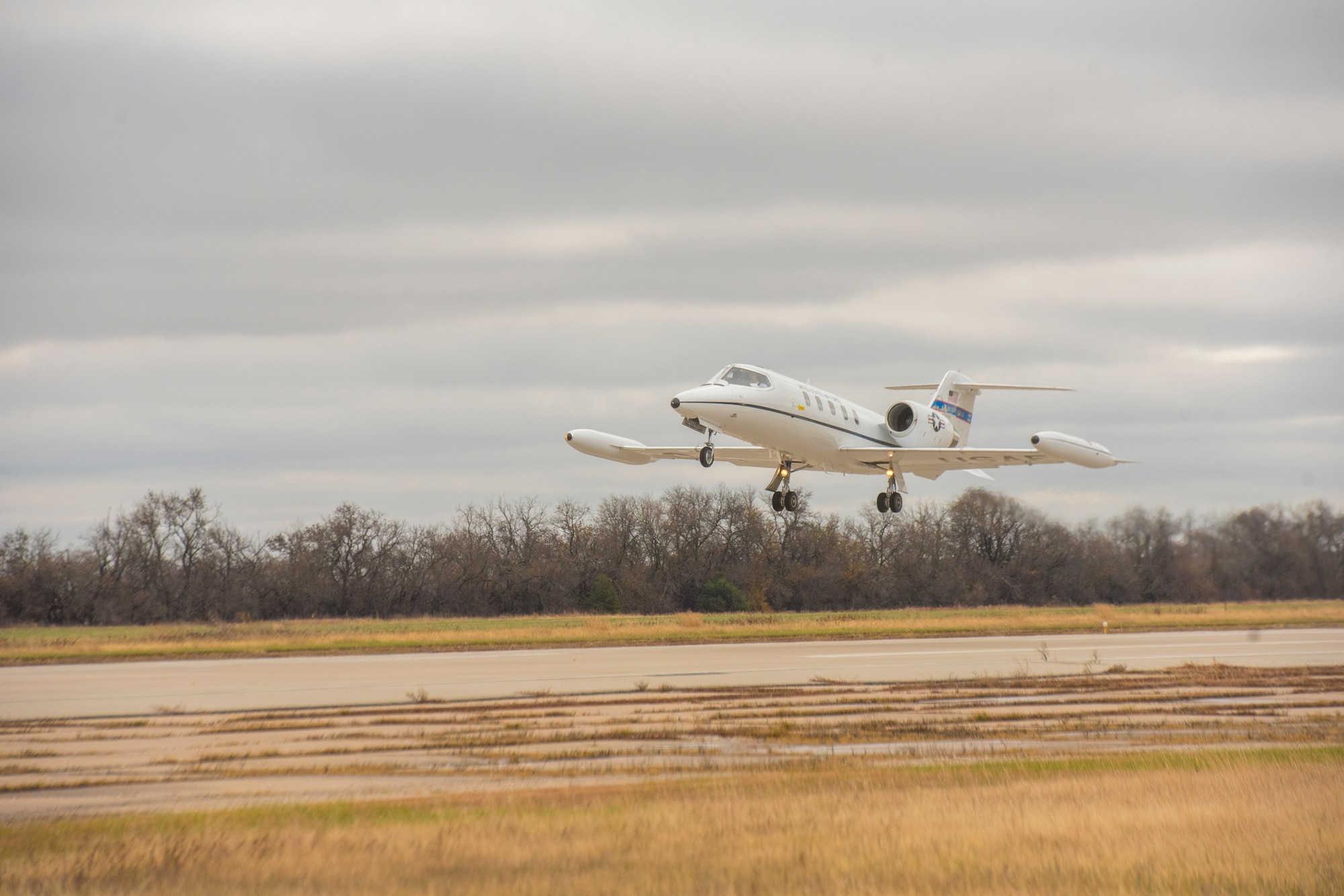 The first C-21A to acquire new “delta fins” takes off Nov. 10, 2020, from Newton City Airport, Kansas. With first model upgrades successfully stabilizing the aircraft, the rest of the fleet will soon follow, allowing the C-21A mission to continue for years to come. (U.S. Air Force photo by Staff Sgt. Nathan Eckert)