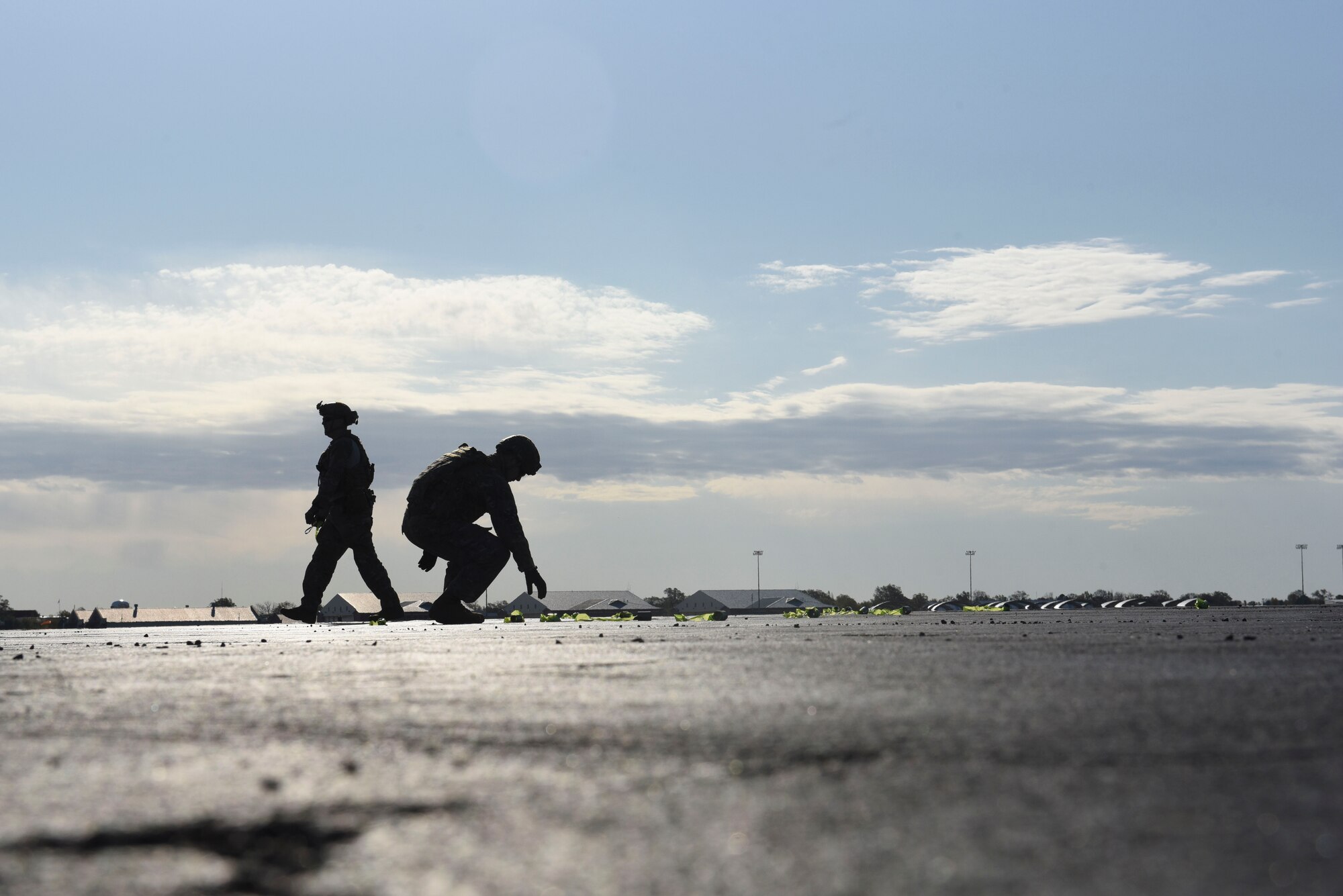 Airmen picking up fake missiles