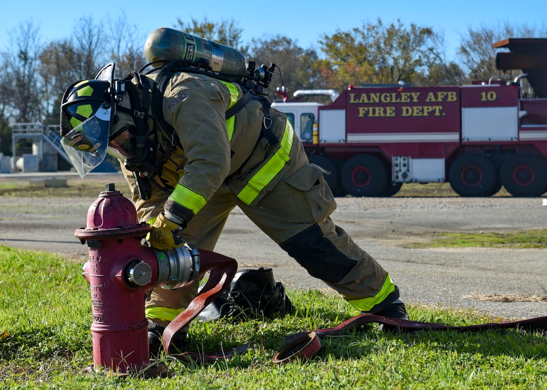 Firefighter connecting a hose