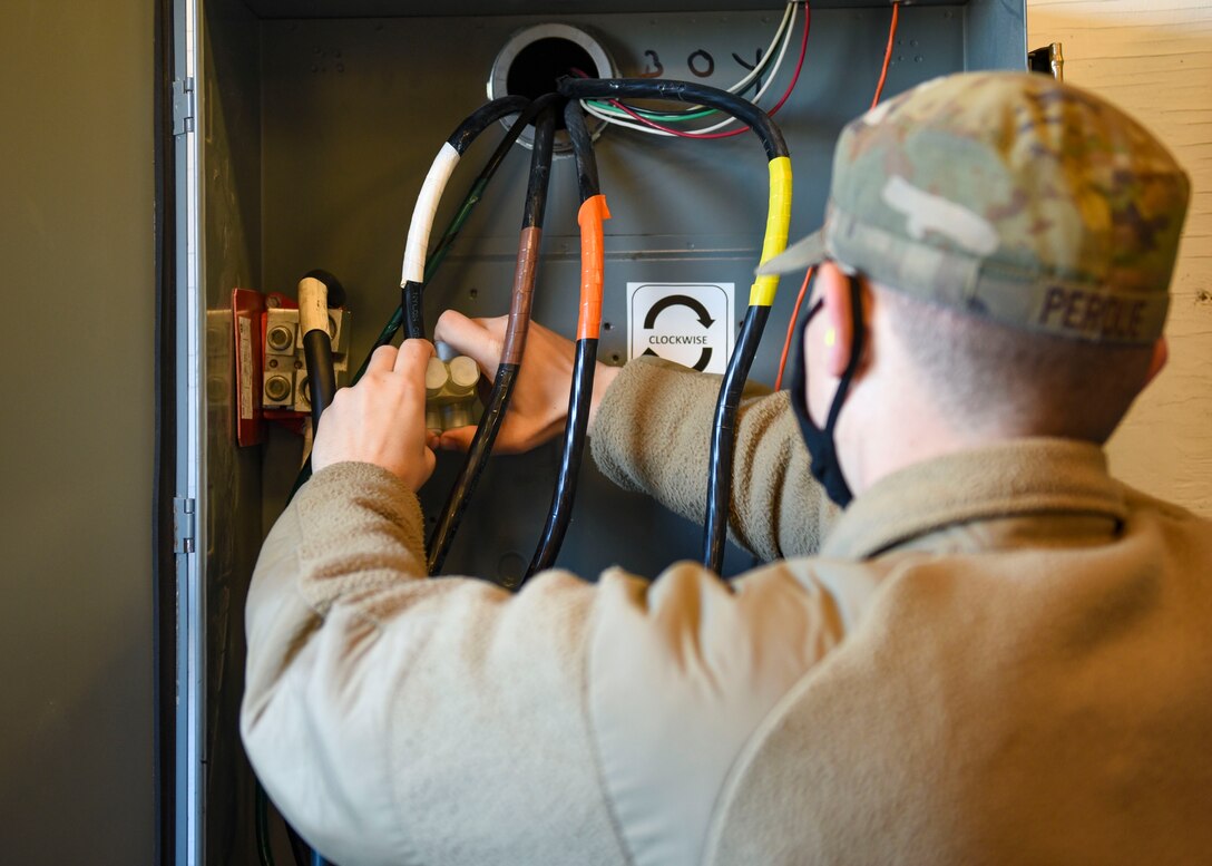 Airman working on electrical cables