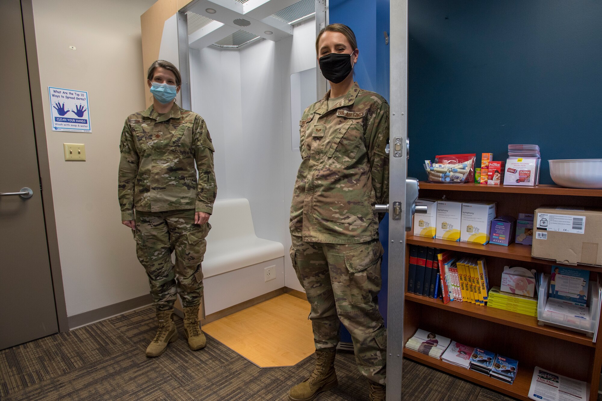 Maj. Brittany K. Hines, officer in charge fetal protection, and Staff Sgt. Caroline M. Schmauch, NCO in charge fetal protection with the 911th Aeromedical Staging Squadron pose in front of the unit’s new lactation booth at Pittsburgh International Airport Air Reserve Station, Pennsylvania, October 4, 2020.