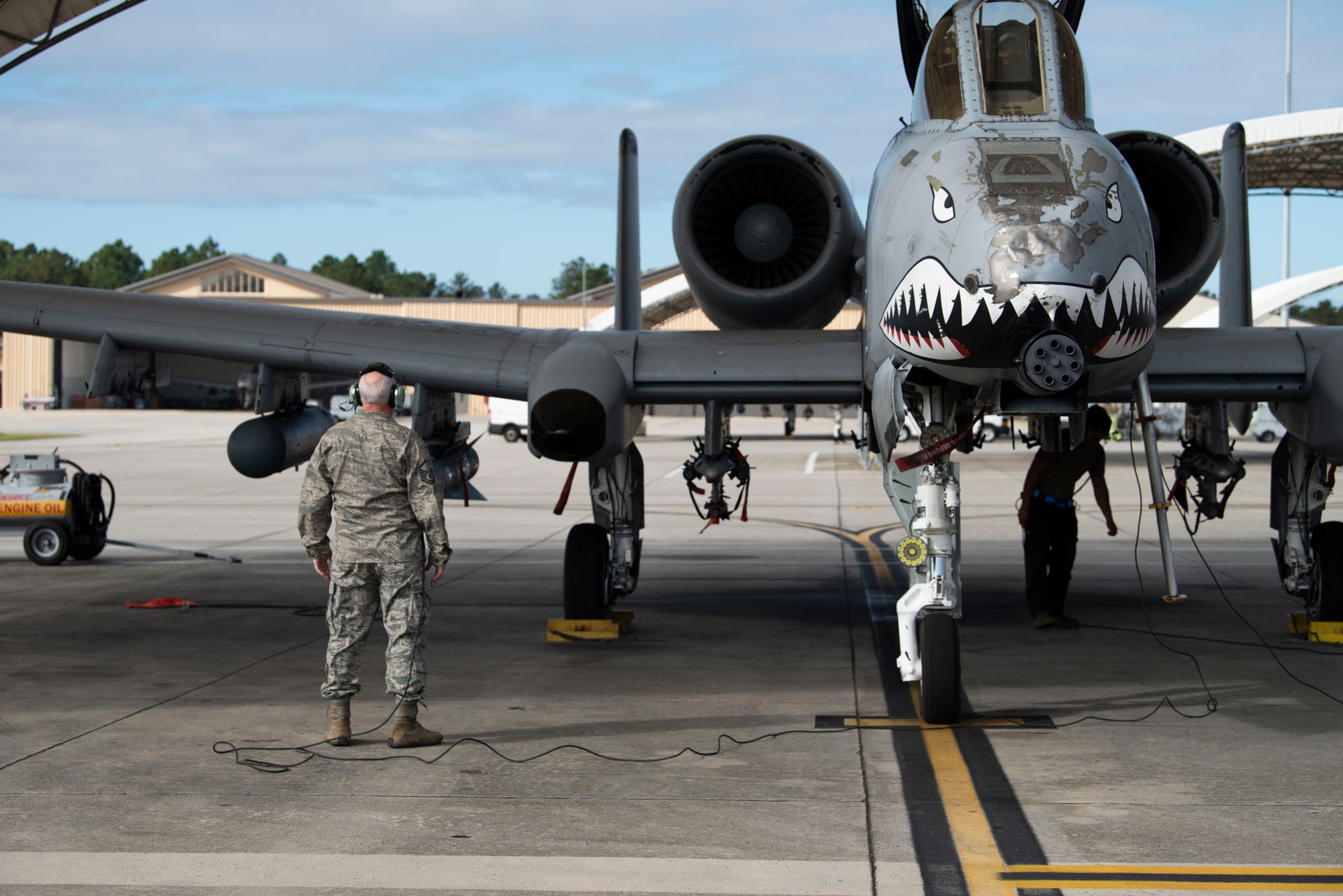 Retired crew chief prepares to launch aircraft.