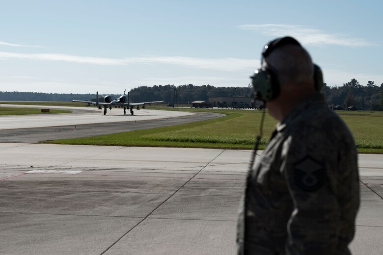 Retired crew chief watches son taxi to the runway.