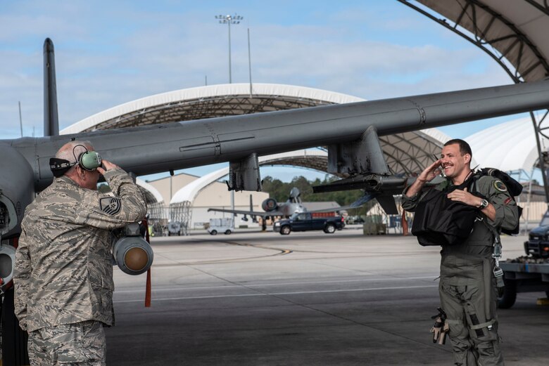 Retired crew chief salutes pilot.