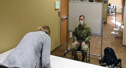 Nurses from the U.S. Air Force, mobilized to North Dakota to aid in the Department of Defense's support to the whole-of-America effort to mitigate COVID-19, progress through their initial orientation at Sanford Medical Center in Bismarck, North Dakota, Nov. 23, 2020.