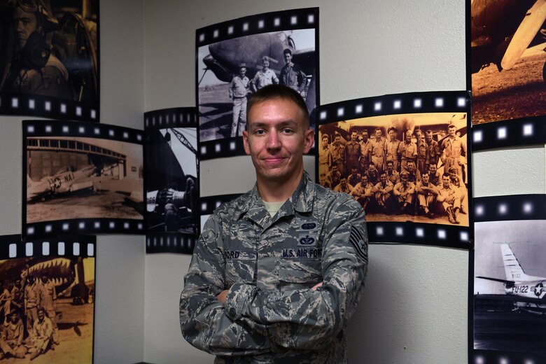 U.S. Air Force Tech. Sgt. Cameron Ford, 33rd Fighter Wing alternate communication security manager, poses for a photo in the 33rd FW heritage room Nov. 13, 2020, at Eglin Air Force Base, Florida. Ford was awarded the Air Force Information Dominance Award for Outstanding Cyber Operations Noncommissioned Officer and will represent the Air Force Education and Training Command against other major command winners across the Air Force. (U.S. Air Force photo by Senior Airman Amber Litteral)
