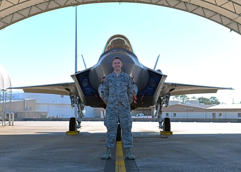 U.S. Air Force Tech. Sgt. Cameron Ford, 33rd Fighter Wing alternate communication security manager, poses for a photo on the flightline Nov. 13, 2020, at Eglin Air Force Base, Florida. Ford was awarded the Air Force Information Dominance Award for Outstanding Cyber Operations Noncommissioned Officer and will represent the Air Force Education and Training Command against other major command winners across the Air Force. (U.S. Air Force photo by Senior Airman Amber Litteral)