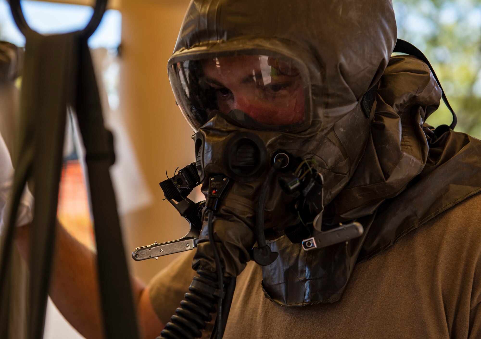 Staff Sgt. Sean Zeringue, 39th Airlift Squadron loadmaster, goes through a decontamination line at Dyess Air Force Base, Texas, Nov. 17, 2020.