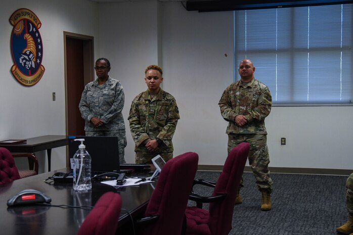 Senior Airman Sidni Muldrow, a relocations journeyman assigned to the 628th Force Support Squadron, Col. Katrina Terry, 628th Mission Support Group commander, and Chief Master Sgt. Jason Colon, 628th Air Base Wing command chief, participate in a teleconference with Air Mobility Command leadership at Joint Base Charleston, S.C., Nov. 24, 2020. Muldrow was recognized for being selected for the Senior Leader Enlisted Commissioning Program – Active Duty during the teleconference.