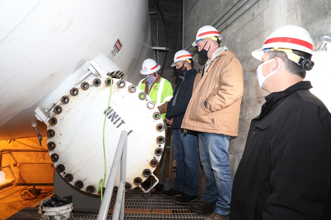 Members from the Omaha District's hydropower team prepare to enter a penstock to inspect a butterfly valve and turbine during a site visit to the Ft. Peck Dam in Montana, Oct. 29, 2020.