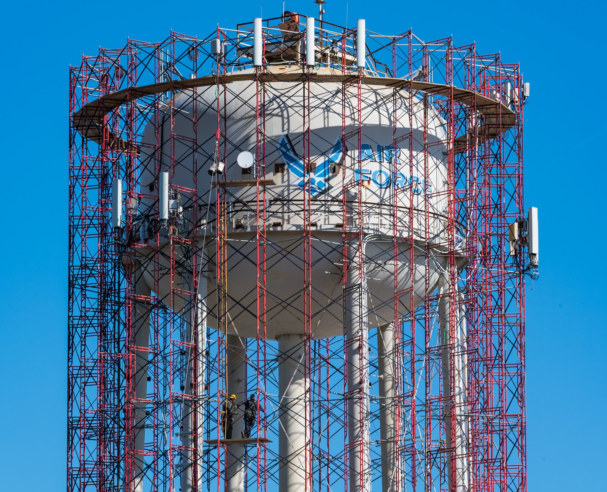 Scaffolding surrounds the base water tower as employees from Allied Painting Inc., Cherry Hill, New Jersey, prepare to conduct periodic internal and external maintenance to the  tower November 5, 2020, on Dover Air Force Base, Delaware. The water tower is operated by Tidewater Utilities Inc. which was also subcontracted for the blasting and painting of the tower. Site preparation and mobilization started on August 24 with a projected completion date in December, weather permitting. (U.S. Air Force photo by Roland Balik)
