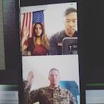 U.S. Air Force 1st Lt. Jacob Geroux, contracting officer, 140th Mission Support Group, delivers the oath of enlistment to Skye Silva, during a virtual enlistment coordinated by U.S. Air Force Tech. Sgt. Alan Cabonilas, production recruiter, 140th Wing, Colorado Air National Guard, June 15, 2020. COANG recruiters continue to find ways to ensure interested community members can safely pursue a military career, even during the COVID-19 pandemic. (Photo courtesy U.S. Air Force Tech. Sgt. Alan Cabonilas)