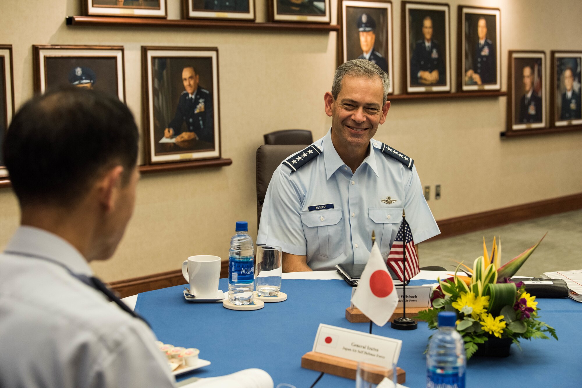 U.S. Air Force Gen. Ken Wilsbach, Pacific Air Forces (PACAF) commander, speaks with Koku-Jieitai Gen. Shunji Izutsu, Chief of Staff Japan Air Self-Defense Force (JASDF), during a bilateral discussion on Joint Base Pearl Harbor-Hickam, Hawaii, Nov. 19, 2020. The visit gave the opportunity for Japan and the U.S. to discuss operational priorities, to include the F-35 program, the ongoing COVID-19 pandemic and the importance of partnership and alliance. (U.S. Air Force photo by Staff Sgt. Hailey Haux)