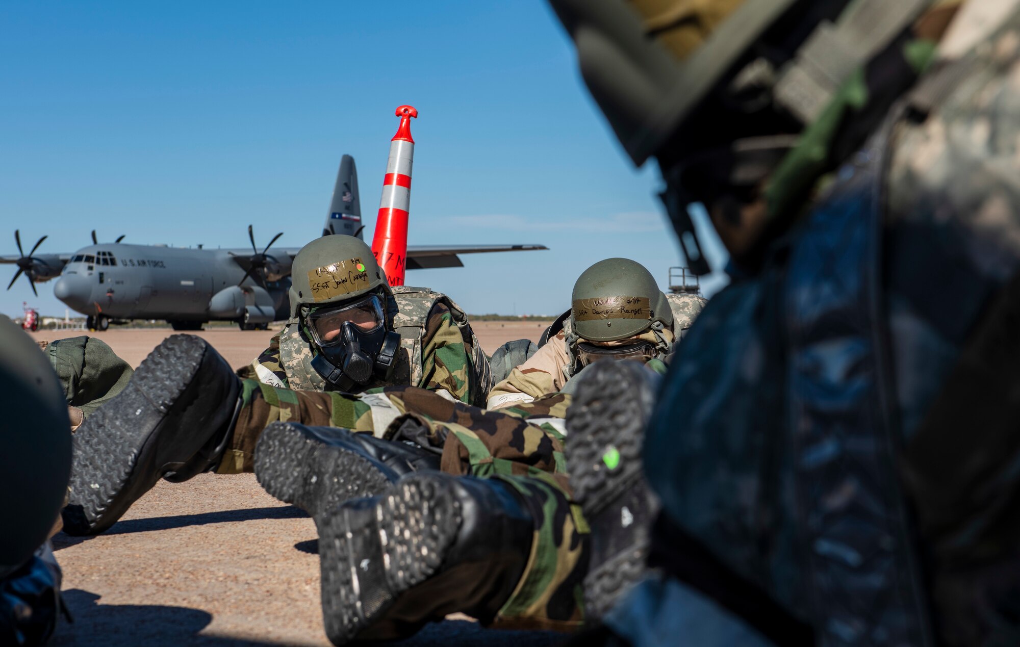 Airmen assigned to the 317th Aircraft Maintenance Squadron lay in a simulated bunker during an exercise at Dyess Air Force Base, Texas. Nov. 18, 2020.