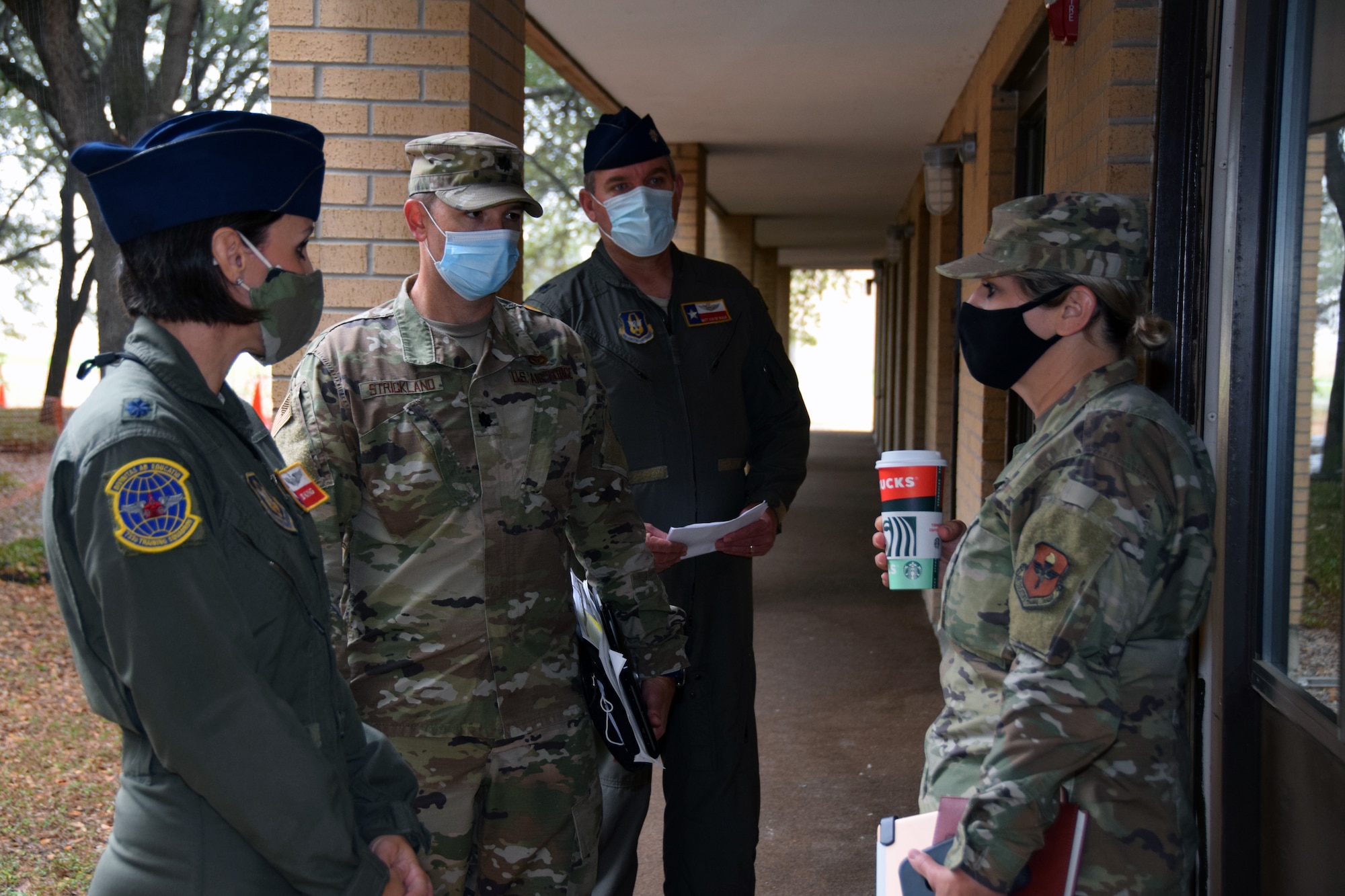 Lt. Col. Brandi B. King, 733rd Training Squadron director of operations, briefs Lt. Col. Brian K. Strickland, 502nd Civil Engineer Group deputy director, Lt. Col. Andrew C. Van De Walle, 433rd Operations Group deputy commander, and Brig. Gen. Caroline M. Miller, 502nd Air Base Wing commander, about the 433rd Airlift Wing’s C-5M Super Galaxy formal training unit’s student lodging facility requirements Nov. 24, 2020 at Joint Base San Antonio-Lackland, Texas. Miller, who assumed command of Joint Base San Antonio in June 2020, toured the facility to learn more about the FTU’s student support needs as a partner unit here. (U.S. Air Force photo by Tech. Sgt. Iram Carmona)