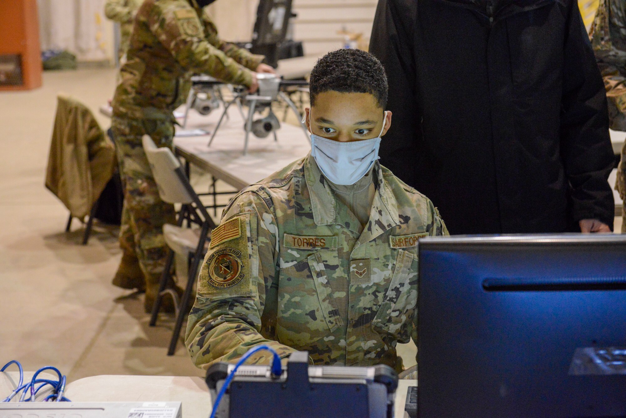 U.S. Air Force Airman 1st Class Devonte Torres, 354th Civil Engineer Squadron operations manager, operates a Small Unmanned Aircraft System during a newly adopted Rapid Airfield Damage Assessment System training course at Joint Base Elmendorf-Richardson, Alaska, Nov. 17, 2020. Throughout the first week of training Airmen focused on learning to fly the SUAS. During the second week they learned to fly the RADAS mission while using the new system. (U.S. Air Force photo by Airman 1st Class Jordan Smith)