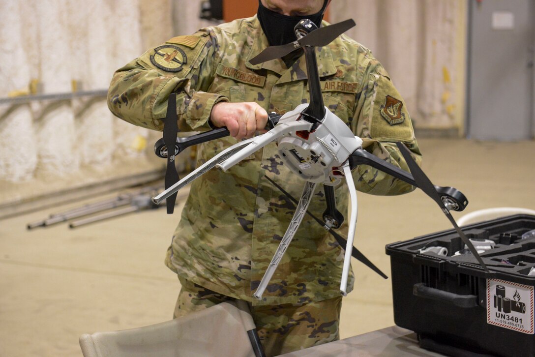 U.S. Air Force Tech. Sgt. Matthew Youngblood, 773d Civil Engineer Squadron HVAC-R craftsman, assembles a Small Unmanned Aircraft System during a newly adopted Rapid Airfield Damage Assessment System training course at Joint Base Elmendorf-Richardson, Alaska, Nov. 17, 2020. Throughout the first week of training Airmen focused on learning to fly the SUAS. During the second week they learned to fly the RADAS mission while using the new system. (U.S. Air Force photo by Airman 1st Class Jordan Smith)