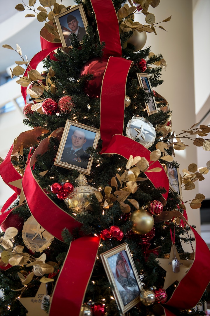 IMAGE: The Oklahoma National Guard Gold Star Tree stands in the 3rd Floor atrium of the Oklahoma History Center in Oklahoma City, Nov. 25, 2020.

The Oklahoma National Guard Gold Star Tree honors the 20 Oklahoma National Guard members who died while serving overseas since 9/11. The tree is decorated with photos and the names of the 19 Army National Guard Soldiers and One Air National Guard Airman who paid the ultimate sacrifice while serving our nation. (Oklahoma National Guard photo by Anthony Jones)