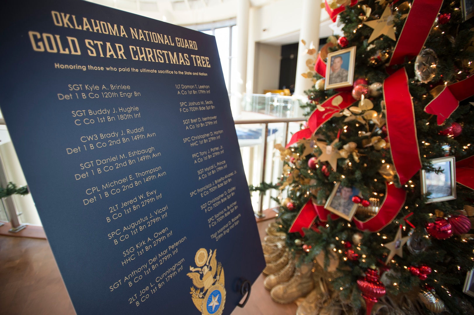 IMAGE: The Oklahoma National Guard Gold Star Tree stands in the 3rd Floor atrium of the Oklahoma History Center in Oklahoma City, Nov. 25, 2020.

The Oklahoma National Guard Gold Star Tree honors the 20 Oklahoma National Guard members who died while serving overseas since 9/11. The tree is decorated with photos and the names of the 19 Army National Guard Soldiers and One Air National Guard Airman who paid the ultimate sacrifice while serving our nation. (Oklahoma National Guard photo by Anthony Jones)