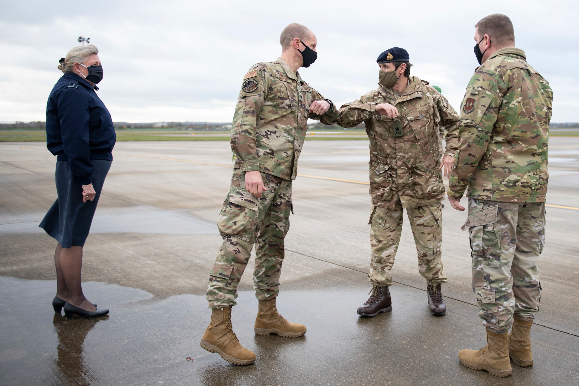 U.S. Air Force Lt. Col. Joseph Knothe, center left, 420th Air Base Squadron commander, welcomes British Army Lt. Gen. Ivan B. L. Jones CB, Commander Field Army, center right, at RAF Fairford, England, Nov. 17, 2020, during NATO Exercise Loyal Leda 2020 (LOLE20). Allied Land Command (LANDCOM) conducted a combat readiness evaluation on the NATO Headquarters Allied Rapid Reaction Corp (ARRC) during LOLE20, which took place at RAF Fairford and South Cerney, England, Nov. 9-19, 2020. This was a complex multi-domain exercise designed to test the war-fighting capabilities of the ARRC in a COVID-19 environment including combat operations. LOLE20 was a key NATO exercise to validate and certify the Gloucester-based ARRC as a NATO war-fighting corps at full operational readiness, capable of commanding up to 120,000 multinational troops across a full spectrum of military operations. (U.S. Air Force photo by Senior Airman Jennifer Zima)