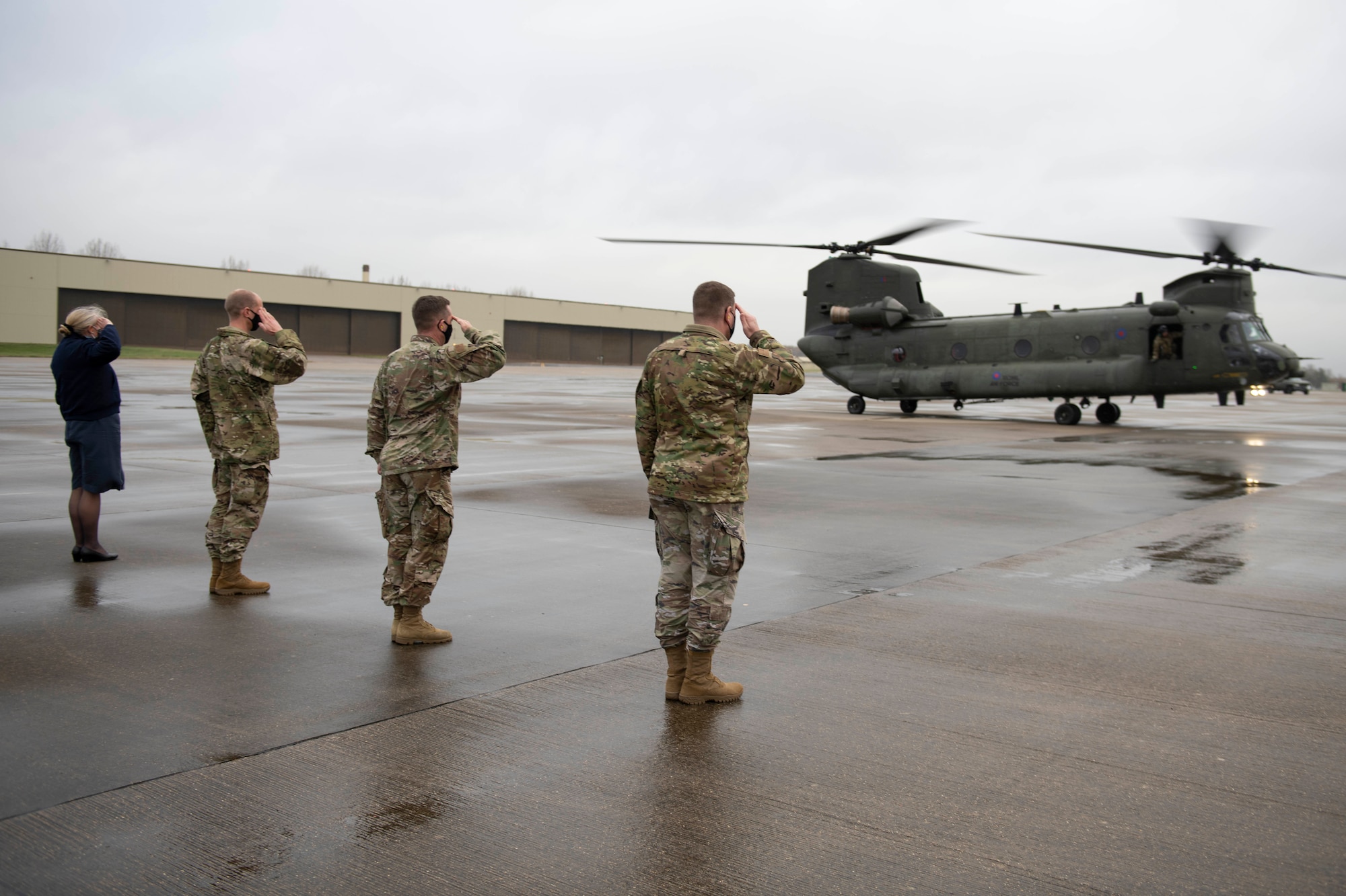 U.S. Air Force Col. Kurt Wendt, right, 501st Combat Support Wing commander, U.S. Air Force Col. Jon Hannah, second right, 422nd Air Base Group commander, U.S. Air Force Lt. Col. Joseph Knothe, second left, 420th Air Base Squadron commander, and Royal Air Force Sqn. Ldr. Jayne Robertson, left, RAF Fairford RAF commander, salute the departure of U.S. Air Force Gen. Tod D. Wolters, NATO Supreme Allied Commander Europe and U.S. European Command commander, British Army Gen. Tim Radford, Deputy Supreme Allied Commander Europe (DSACEUR) for NATO, German Army Gen. Jörg Vollmer, Allied Joint Force Command Brunssum commander, and U.K. Chief of the Defence Staff, Gen. Sir Nick Carter GCB CBE DSO ADC Gen, on a Royal Air Force CH-47 Chinook helicopter at Royal Air Force Fairford, England, Nov. 18, 2020, in support of NATO Exercise Loyal Leda 2020 (LOLE20). Allied Land Command (LANDCOM) conducted a combat readiness evaluation on the NATO Headquarters Allied Rapid Reaction Corp (ARRC) during LOLE20, which took place at RAF Fairford and South Cerney, England, Nov. 9-19, 2020. This was a complex multi-domain exercise designed to test the war-fighting capabilities of the ARRC in a COVID-19 environment including combat operations. LOLE20 was a key NATO exercise to validate and certify the Gloucester-based ARRC as a NATO war-fighting corps at full operational readiness, capable of commanding up to 120,000 multinational troops across a full spectrum of military operations. (U.S. Air Force photo by Senior Airman Jennifer Zima)