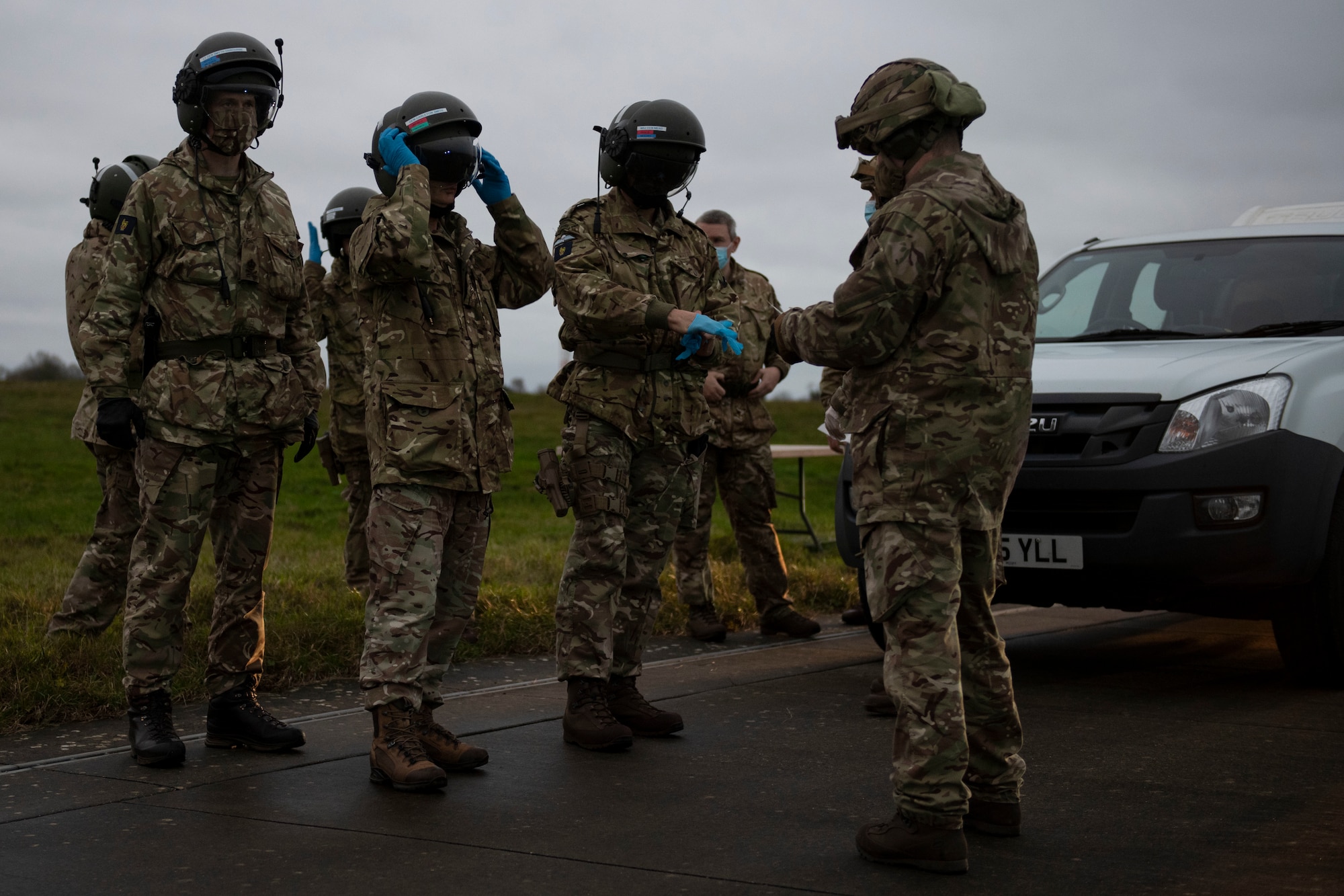 British Army Lt. Gen. Sir Edward Smyth-Osbourne KCVO CBE, left, NATO’s Allied Rapid Reaction Corps commander, British Army Gen. Sir Mark Carleton-Smith KCB CBE ADC Gen., second left, Chief of the General Staff, British Army Maj. Gen. John Mead, second right, NATO’s Allied Rapid Reaction Corps Chief of Staff, and other distinguished visitors prepare to board a Royal Air Force CH-47 Chinook helicopter at RAF Fairford, England, Nov. 17, 2020, for a flight to South Cerney in  in support of NATO Exercise Loyal Leda 2020 (LOLE20). Allied Land Command (LANDCOM) conducted a combat readiness evaluation on the NATO Headquarters Allied Rapid Reaction Corp (ARRC) during LOLE20, which took place at RAF Fairford and South Cerney, England, Nov. 9-19, 2020. This was a complex multi-domain exercise designed to test the war-fighting capabilities of the ARRC in a COVID-19 environment including combat operations. LOLE20 was a key NATO exercise to validate and certify the Gloucester-based ARRC as a NATO war-fighting corps at full operational readiness, capable of commanding up to 120,000 multinational troops across a full spectrum of military operations. (U.S. Air Force photo by Senior Airman Jennifer Zima)