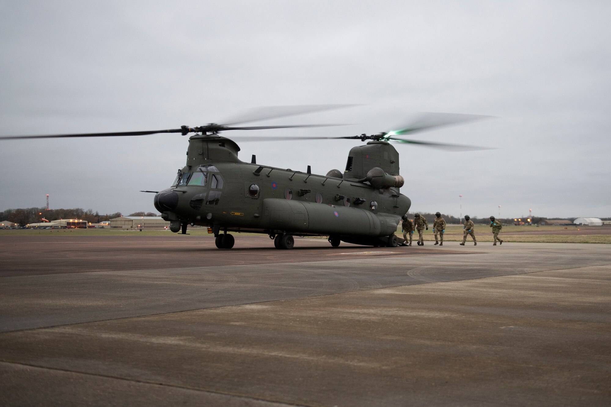 British Army Lt. Gen. Sir Edward Smyth-Osbourne KCVO CBE, NATO’s Allied Rapid Reaction Corps commander, British Army Gen. Sir Mark Carleton-Smith KCB CBE ADC Gen., Chief of the General Staff, British Army Maj. Gen. John Mead, NATO’s Allied Rapid Reaction Corps Chief of Staff, and other distinguished visitors, prepare to board a Royal Air Force CH-47 Chinook helicopter at RAF Fairford, England, Nov. 17, 2020, for a flight to South Cerney in  in support of NATO Exercise Loyal Leda 2020 (LOLE20). Allied Land Command (LANDCOM) conducted a combat readiness evaluation on the NATO Headquarters Allied Rapid Reaction Corp (ARRC) during LOLE20, which took place at RAF Fairford and South Cerney, England, Nov. 9-19, 2020. This was a complex multi-domain exercise designed to test the war-fighting capabilities of the ARRC in a COVID-19 environment including combat operations. LOLE20 was a key NATO exercise to validate and certify the Gloucester-based ARRC as a NATO war-fighting corps at full operational readiness, capable of commanding up to 120,000 multinational troops across a full spectrum of military operations. (U.S. Air Force photo by Senior Airman Jennifer Zima)