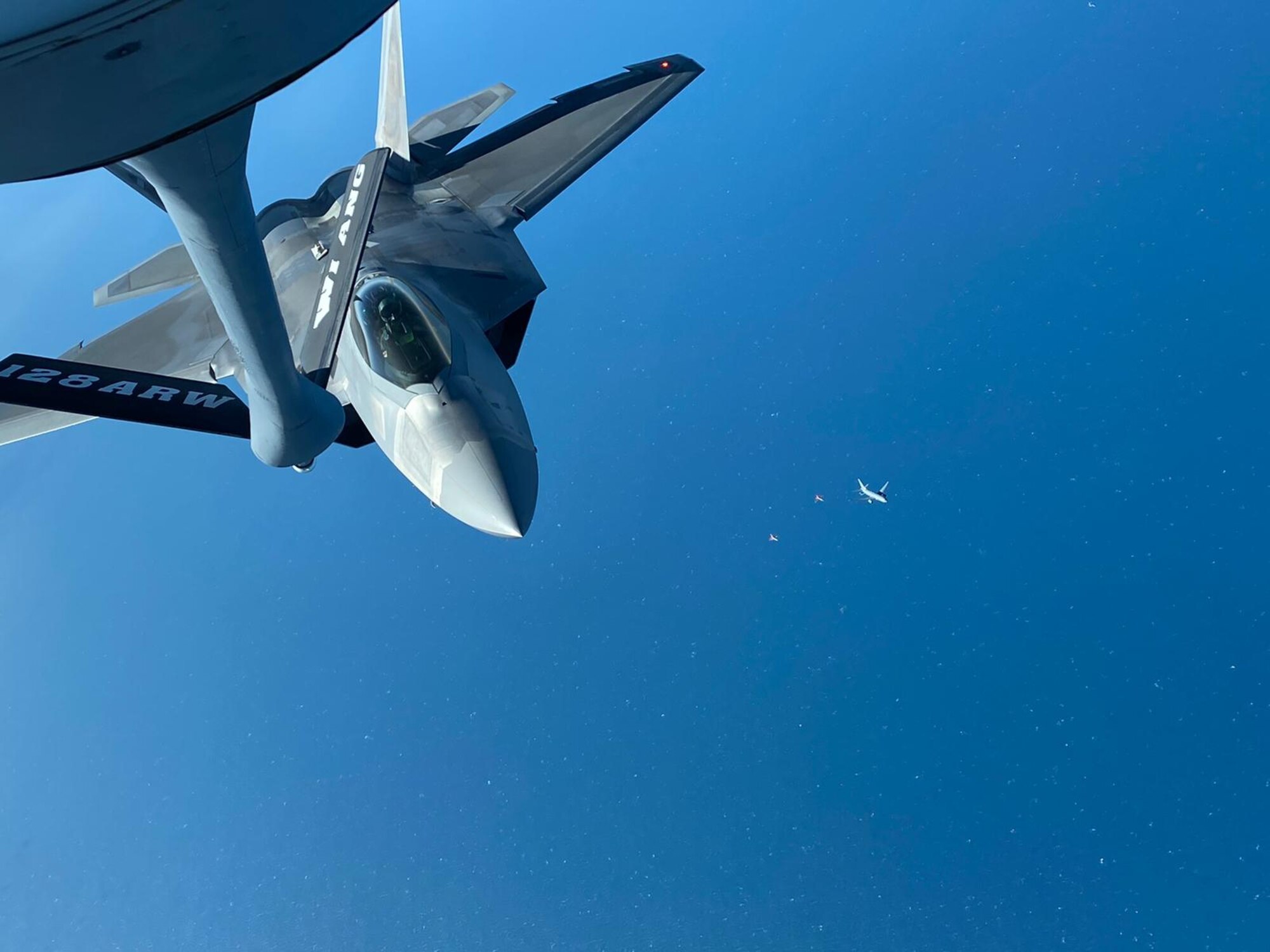 An F-22 Raptor, assigned to the 90th Fighter Squadron, Joint Base Elmendorf-Richardson, Ala., approaches the boom of a KC-135 Stratotanker assigned to the 128th Air Refueling Wing, Wisconsin Air National Guard, during Checkered Flag 21-1, Nov. 2, 2020.