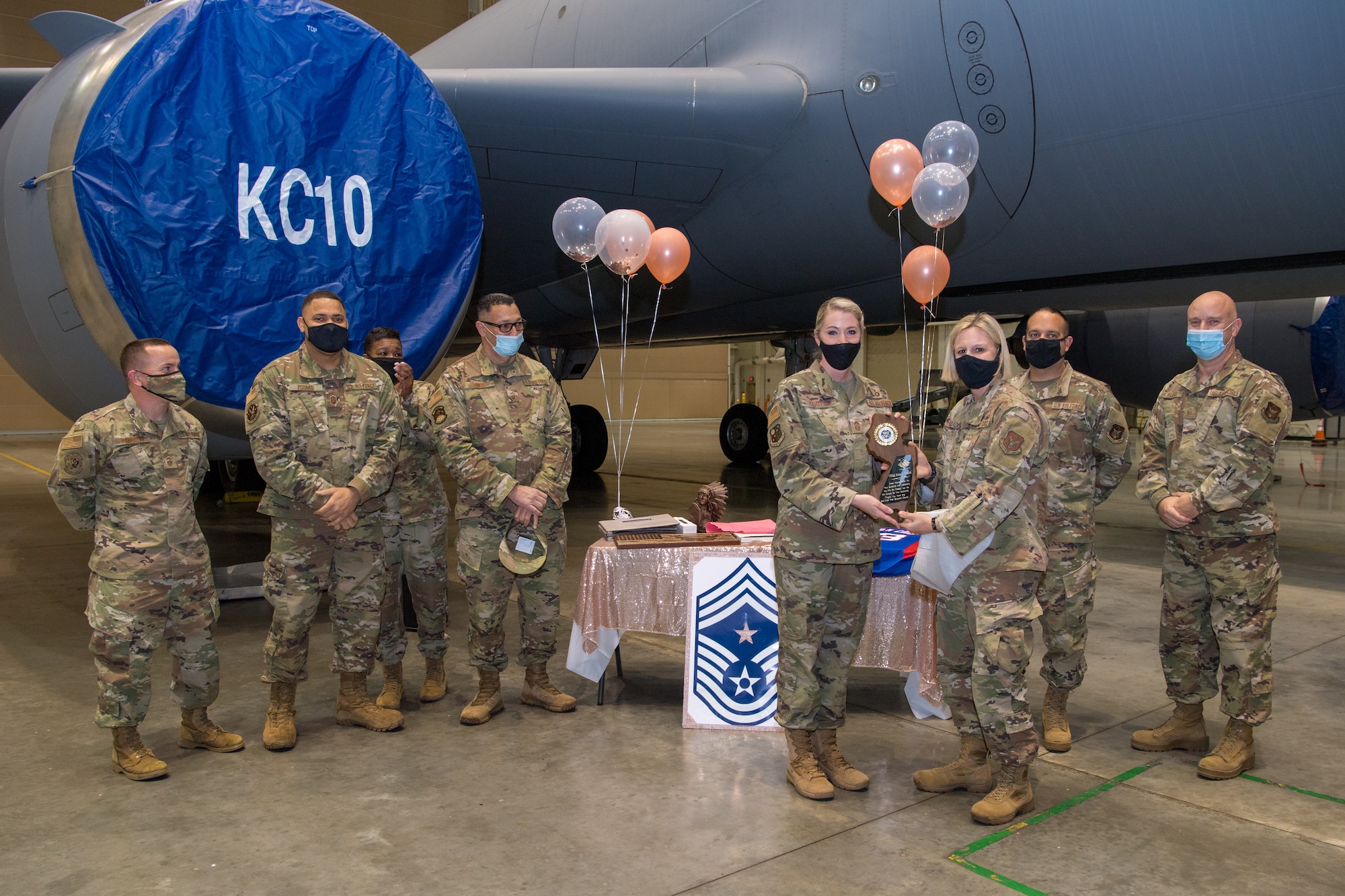 Chief Master Sgt. Dana L. Capaldi, 514th Air Mobility Wing, Joint Base Maguire-Dix-Lakehurst, N.J., received a gift from the 514 AMW first sergeants at her farewell party, November 15, 2020. All persons in attendance practiced social distancing and observed Covid-19 regulations.