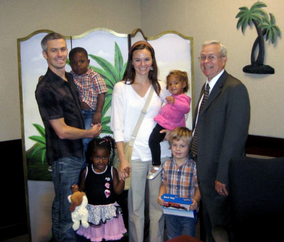 Maj. Matt Menendez and his wife, Evan, on adoption day in Florida, along with the judge who officiated the event. Front, left to right, Nya, age 4, and Zack, 4. Second row, Lenny, 3, and Kimmie. (Courtesy photo)