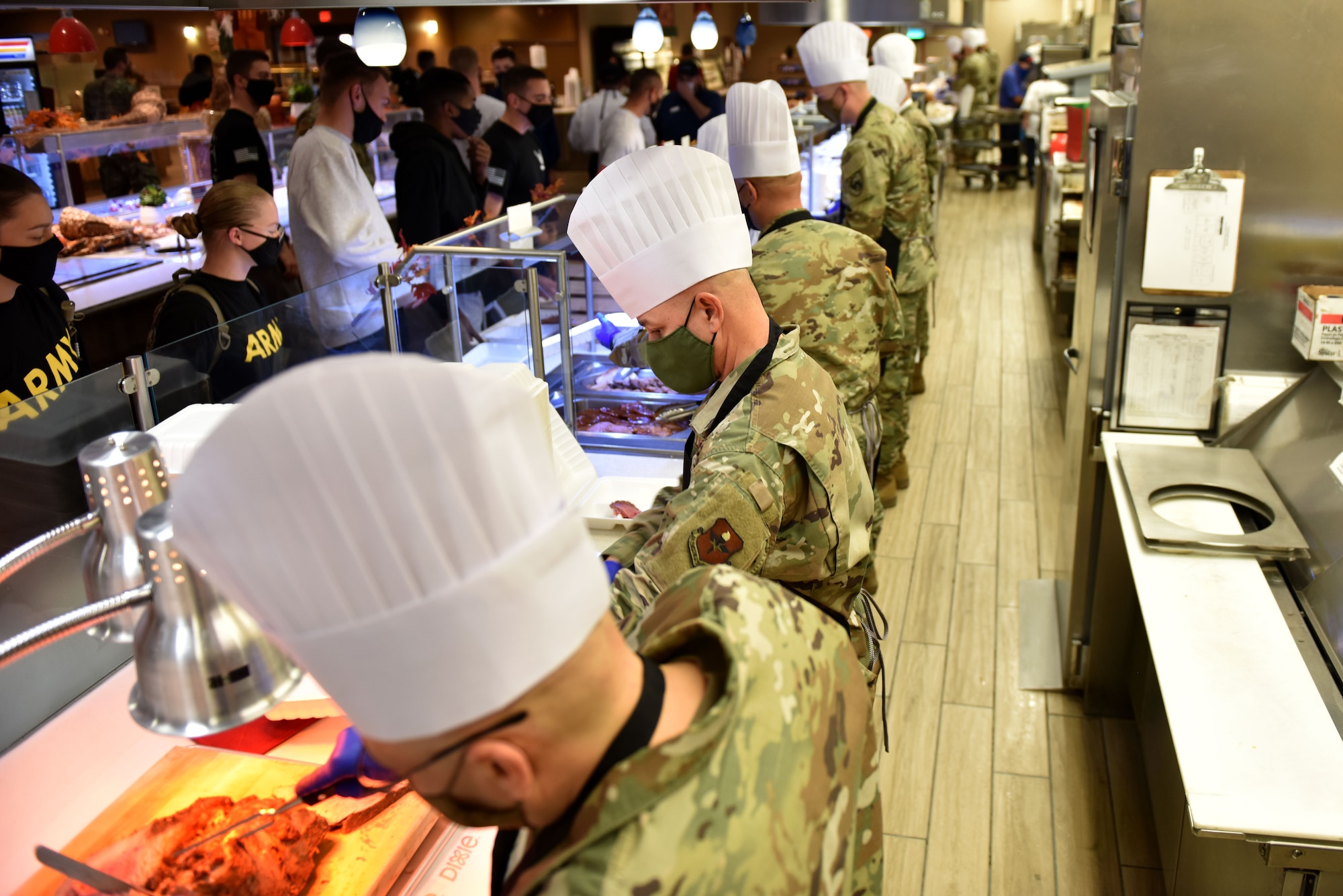 Goodfellow leadership serves Thanksgiving meals to members unable to go home for the holiday at the Western Winds Dining Facility on Goodfellow Air Force Base, Texas, Nov. 26, 2020. Leadership from multiple squadrons and branches served student and permanent party members. (U.S. Air Force photo by Staff Sgt. Seraiah Wolf)