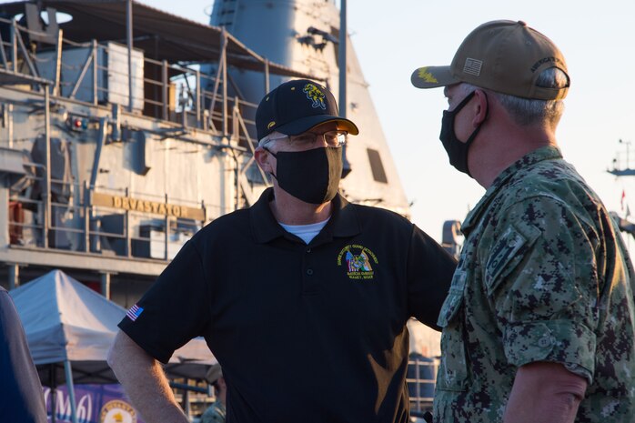 201125-N-IO414-1070 NAVAL SUPPORT ACTIVITY BAHRAIN (Nov. 25, 2020) Capt. Christopher Gilbertson, commanding officer of Commander, Task Force (CTF) 55, right, speaks to Acting Secretary of Defense, Christopher C. Miller during a visit on board Naval Support Activity Bahrain, Nov 25. CTF 55 commands surface forces such as U.S. Navy patrol craft, U.S. Coast Guard patrol boats and independently deployed ships in U.S. 5th Fleet area of operations, which encompasses nearly 2.5 million square miles of water area and includes the Arabian Gulf, Gulf of Oman, Red Sea and parts of the Indian Ocean. The region is comprised of 20 countries and includes three critical choke points at the Strait of Hormuz, the Suez Canal and the Strait of Bab-al-Mandeb at the Southern tip of Yemen.