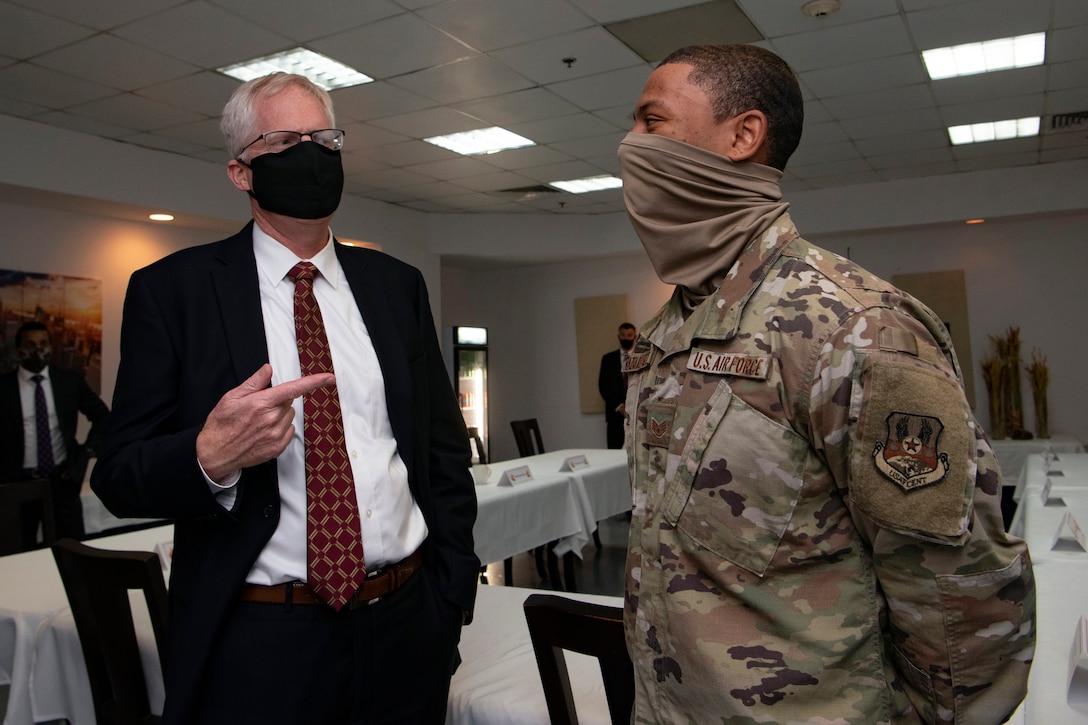 Acting Defense Secretary Christopher C. Miller speaks with a service member.