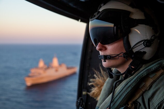 201012-M-JX780-1193 PACIFIC OCEAN (Oct. 12, 2020) ‒ U.S. Navy Hospital Corpsman 3rd Class Addison Avell, also a UH-1Y Venom aerial observer with Marine Medium Tiltrotor Squadron 164 (Reinforced), 15th Marine Expeditionary Unit, scans for hazards from a UH-1Y Venom during flight operations while underway. The Makin Island Amphibious Ready Group and the 15th MEU are currently conducting at-sea training events in the U.S. 3rd Fleet area of operations. (U.S. Marine Corps photo by Lance Cpl. Brendan Mullin)