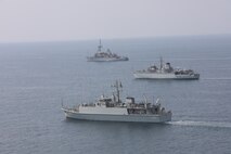 Royal Saudi Naval Force mine countermeasures vessel Al-Shaqra (MCMV 422), front, Royal Navy mine countermeasures vessel HMS Brocklesby (M 33), middle, and mine countermeasure ship USS Dextrous (MCM 13) sail in formation during mine countermeasures interoperability training, led by Commander, Task Force (CTF) 52 in the Arabian Gulf, Nov. 11. CTF 52 provides command and control of all mine warfare assets in the U.S. 5th Fleet area of operations. The 5th Fleet area of operations encompasses about 2.5 million square miles of water area and includes the Arabian Gulf, Arabian Sea, Gulf of Oman, Red Sea and parts of the Indian Ocean. The expanse is comprised of 20 countries and includes three critical choke points at the Strait of Hormuz, the Suez Canal and the Bab el-Mandeb Strait at the southern tip of Yemen.