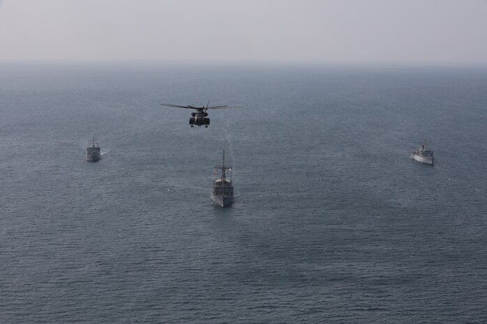 Royal Saudi Naval Force mine countermeasures vessel Shaqra (422), left, mine countermeasure ship USS Dextrous (MCM 13), middle, Royal Navy mine countermeasures vessel HMS Brocklesby (M 33) and a MH-53E Sea Dragon helicopter, attached to Helicopter Mine Countermeasures Squadron 15, sail in formation during mine countermeasures interoperability training, led by Commander, Task Force (CTF) 52 in the Arabian Gulf, Nov. 11. CTF 52 provides command and control of all mine warfare assets in the U.S. 5th Fleet area of operations. The 5th Fleet area of operations encompasses about 2.5 million square miles of water area and includes the Arabian Gulf, Arabian Sea, Gulf of Oman, Red Sea and parts of the Indian Ocean. The expanse is comprised of 20 countries and includes three critical choke points at the Strait of Hormuz, the Suez Canal and the Bab el-Mandeb Strait at the southern tip of Yemen.