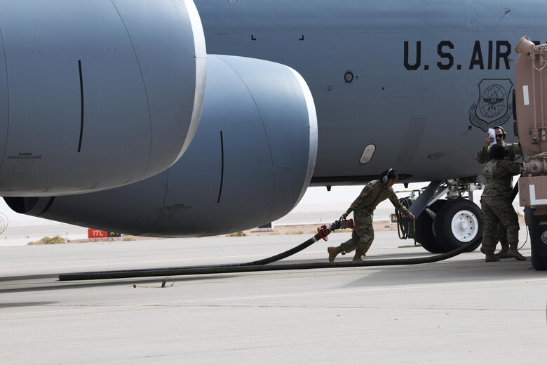 Fuels, maintenance Airmen perform hot pit refuel