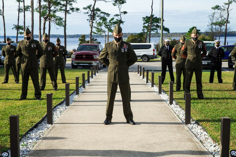 U.S. Marines bow their heads during the invocation at a French Fourragrere dedication ceremony on Camp Lejeune, N.C., Nov. 25.