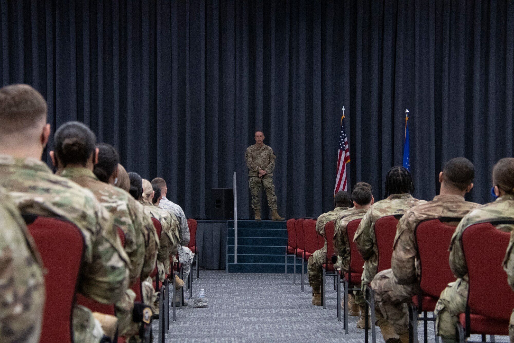 Airmen listen during a town hall meeting.