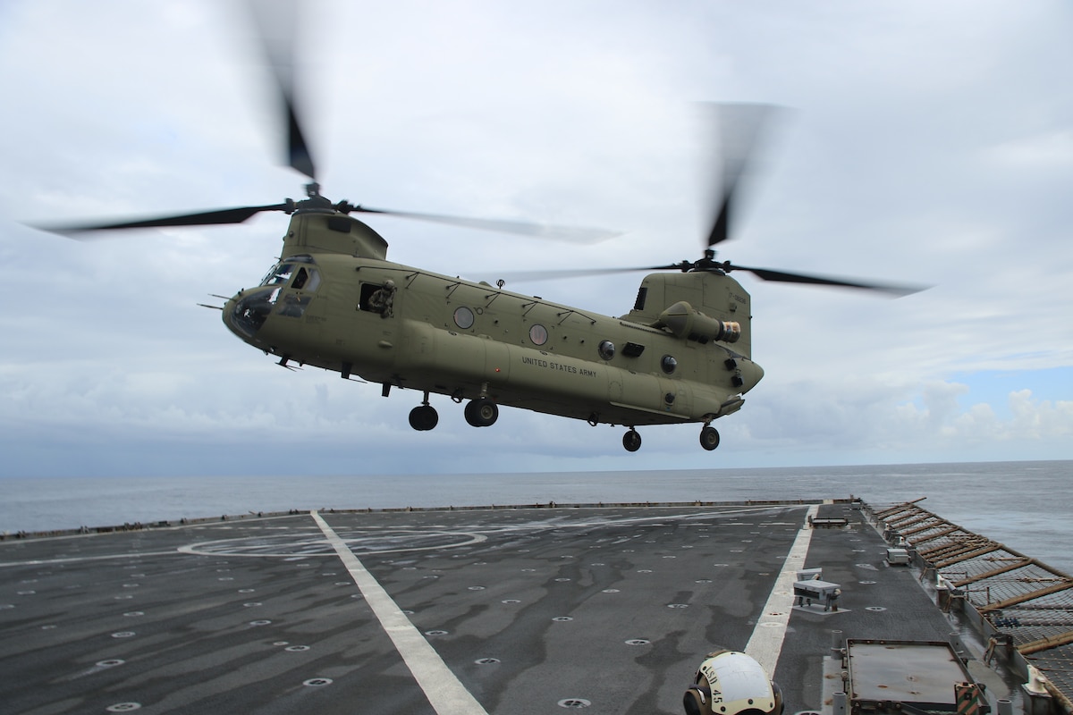 A CH-47 Chinook helicopter takes off from the flight deck of USS Comstock (LSD 45) in support of U.S. Southern Command’s Hurricane Iota relief efforts in Central America.