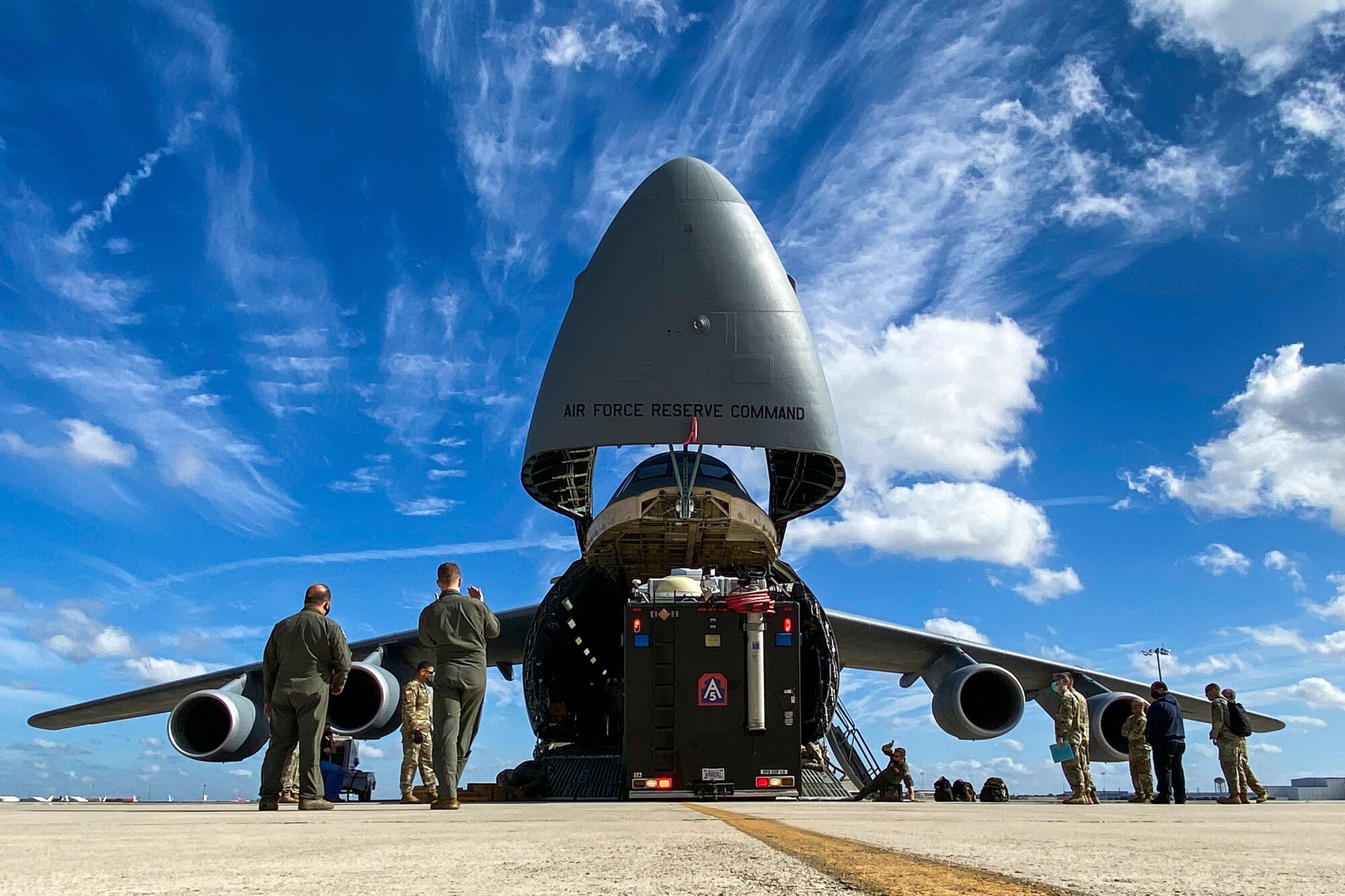 Soldiers assigned to U.S. Army North’s Task Force 51 and Airmen assigned to the 68th Airlift Squadron load the Sentinel, otherwise known as ARNORTH’s mobile command post, during the unit’s Level II Deployment Readiness Exercise at Joint Base San Antonio-Kelly Field Annex Nov. 20.